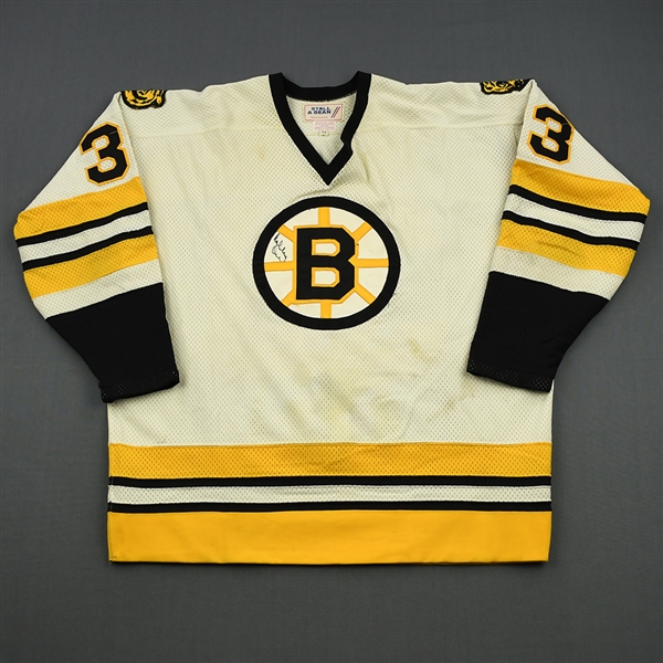 Melnyk, Larry *<br>White  - Autographed on the crest by Bobby Orr<br>Boston Bruins 1980-81<br>#33 Size: 52