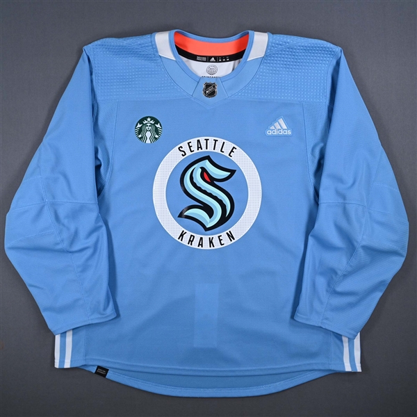 Beniers, Matty<br>Ice Blue Practice Jersey w/ Starbucks Patch<br>Seattle Kraken 2023-24<br>#10 Size: 56