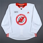 Bastian, Nathan<br>White Practice Jersey w/ RWJ Barnabas Health Patch<br>New Jersey Devils 2022-23<br>#14 Size: 56