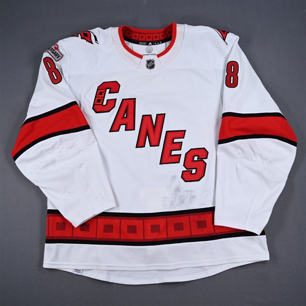 Burns, Brent *<br>White Set 2 w/ 25th Anniversary Patch<br>Carolina Hurricanes 2022-23<br>#8 Size: 58